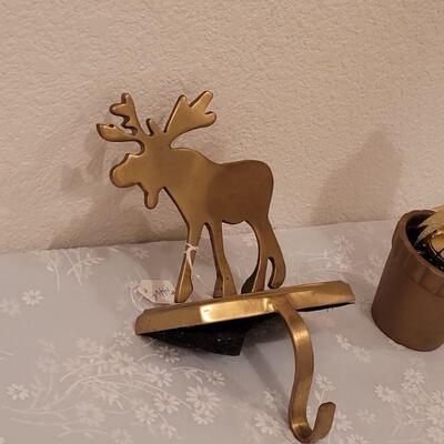 Lot 57: New Heavy Brass Moose Stocking Holder and Gold Bell Topiary 