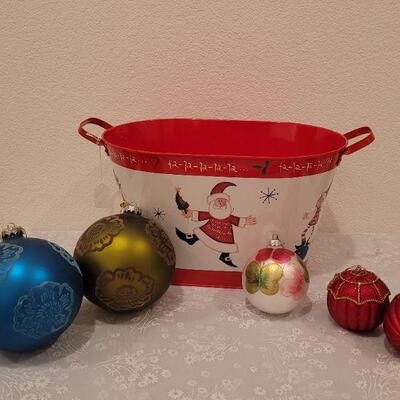 Lot 65: New Large Christmas Metal Bucket, (2) Extra Large Glass Flocked Flower Ornaments, Handpainted Vintage Ornament and (2) Red & Gold...