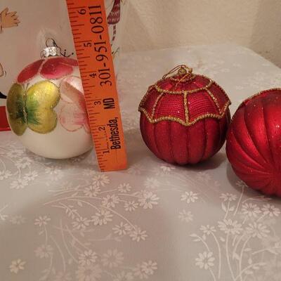 Lot 65: New Large Christmas Metal Bucket, (2) Extra Large Glass Flocked Flower Ornaments, Handpainted Vintage Ornament and (2) Red & Gold...