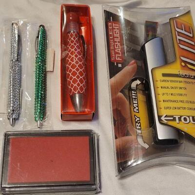 Lot 100: New Pens and Stamp Pad and Flash Light Lot