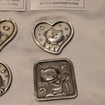 Lot 113: (4) Cat Pocket Tokens/Charms