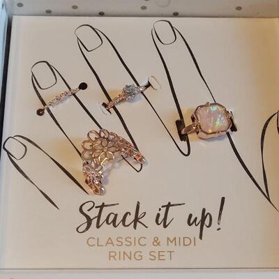 Lot 131: New Gold Stackable Rings, Interchangeable Pendant Necklace and Cell Phone Charm