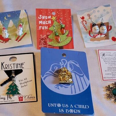 Lot 135: New Christmas Earrings, Cellphone Charm, Nativity Pin, and Snowflake Mood Charm