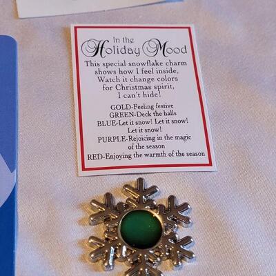 Lot 135: New Christmas Earrings, Cellphone Charm, Nativity Pin, and Snowflake Mood Charm