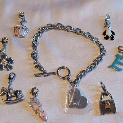 Lot 143: New Charm Bracelet with Charms