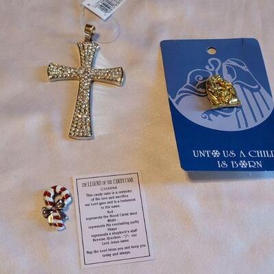 Lot 154: New Large Rhinestone Cross Pendant, Nativity Pin and Candy Cane Charm
