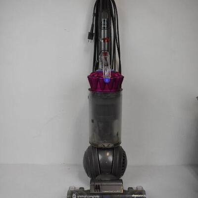 Dyson DC65 Vacuum. Works. Wheel doesn't Spin. Canister open release is broken