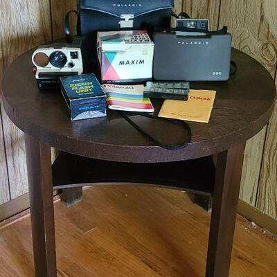 Lot 169: Round Side Table & Vintage Camera