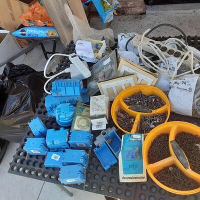 lot 253 - Gray bin of assorted plumbing parts AS SHOWN