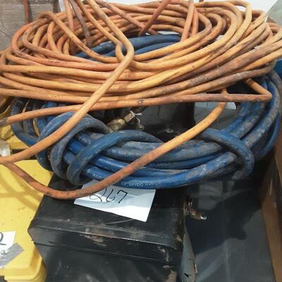 lot 267 Black metal tool box and contents, ext cord, airhose