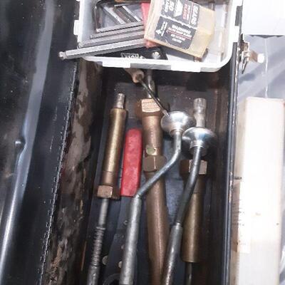 lot 267 Black metal tool box and contents, ext cord, airhose