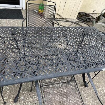 Black wrought iron patio set, table and 4 chairs