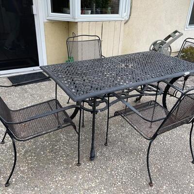 Black wrought iron patio set, table and 4 chairs