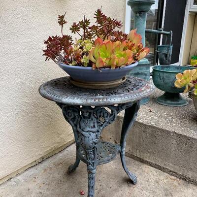 Outdoor patio table & potted plant-  round cast iron figural table vintage 