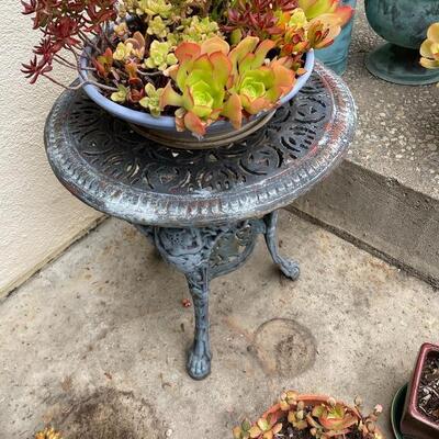 Outdoor patio table & potted plant-  round cast iron figural table vintage 