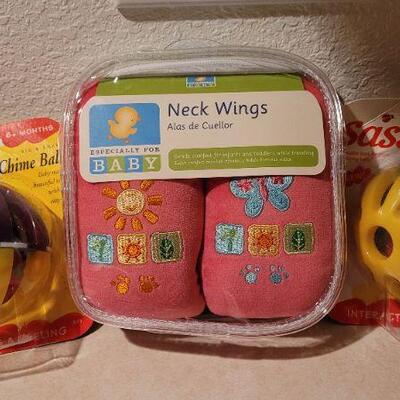 Lot 35: Assorted NEW Baby Items - Toy Balls + Neck Wings