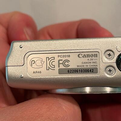 Lot 243 - Canon Powershot Camera, Remotes & Phones