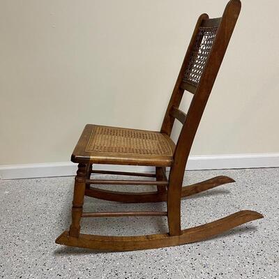 Lot 251 - Small Wooden Rocker w/ Cane Seat & Back
