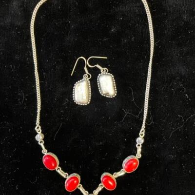 Lot 75LD. Sterling silver necklace and earrings; necklace with red stones set in silver and flanked by rhinestones; one pair of earrings...