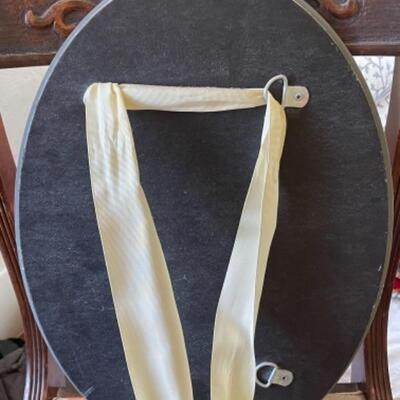 Lot 80BR. Beveled oval mirror (â€œ18â€™x13â€) with ribbon hanger--$12.50