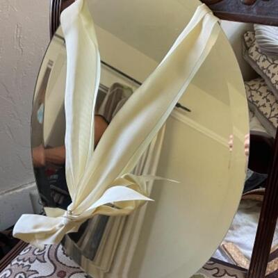 Lot 80BR. Beveled oval mirror (â€œ18â€™x13â€) with ribbon hanger--$12.50