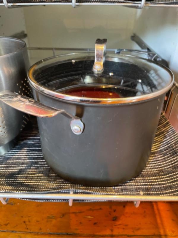 Lot 103K. Emeril stock pot, colander, papier mache cow, oven mitt, placemats“” 11.25