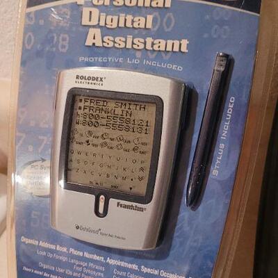 Lot 80: New CD Case + NEW Personal Digital Assistant 