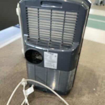 Lot 143 - Air Conditioner and Space Heater
