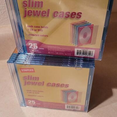 Lot 143: New Colored Slim Jewel Cases (50 Total) 