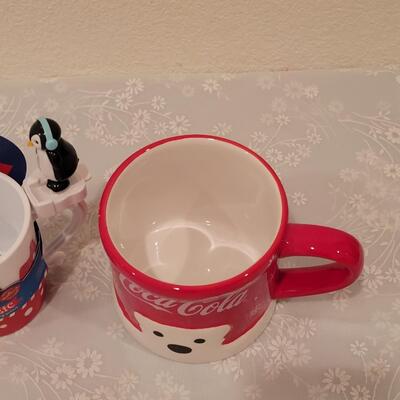 Lot 195: Christmas Coca-Cola Coffee Cup and Marshmallow Kicking Penguin Hot Cocoa Mug