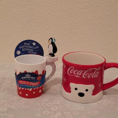 Lot 195: Christmas Coca-Cola Coffee Cup and Marshmallow Kicking Penguin Hot Cocoa Mug