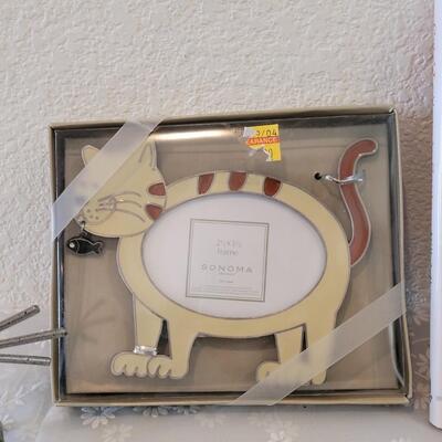 Lot 319: Cat Photo Frames, Book and Paperclips