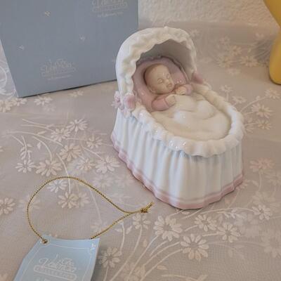Lot 331: Precious Moments Prayer Bunny, Star Bank, Decorative Shoe and Musiacel Baby in Bassinet 