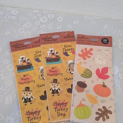 Lot 389: Holiday Stickers and Hello Kitty Candy Tins