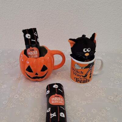 Lot 393: Halloween Coffee Mugs and Dish Towels (2)