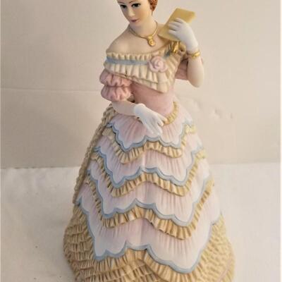 Lot #86  Two Lenox Figurines "Belle of the Ball" and "Cherished Moments"