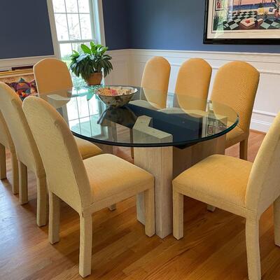 Fabulous glass and marble dining table with freshly upholstered pale yellow chairs