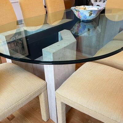 Fabulous glass and marble dining table with freshly upholstered pale yellow chairs