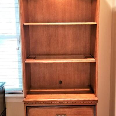 Lot #95  Lighted Contemporary Bookcase with Drawers