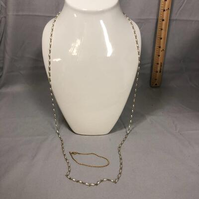Lot 182 - Long White Bead and Gold Tone Link Necklace