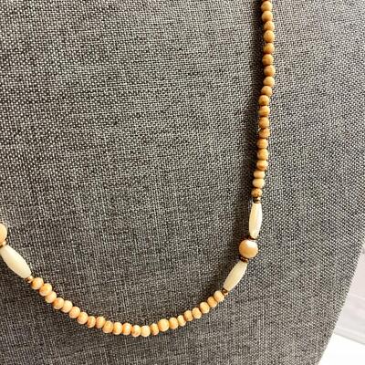 Lot 23  Strand of Tea Stained Faux Bone & MOP Necklace