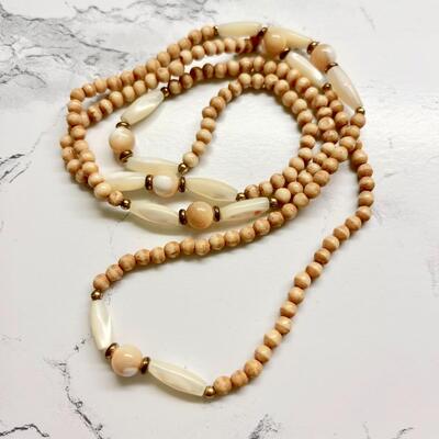 Lot 23  Strand of Tea Stained Faux Bone & MOP Necklace