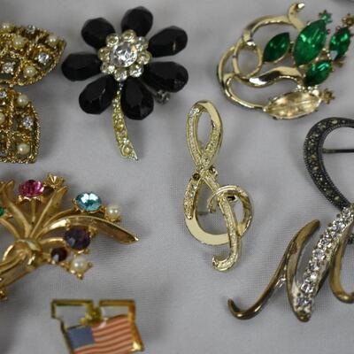 Lot of Costume Pins: Flags, Christian Symbology, Flowers, Parrot, and more