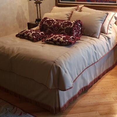 Queen Bed With Tan Linens/Pillows and Headboard--No Mattresses Included