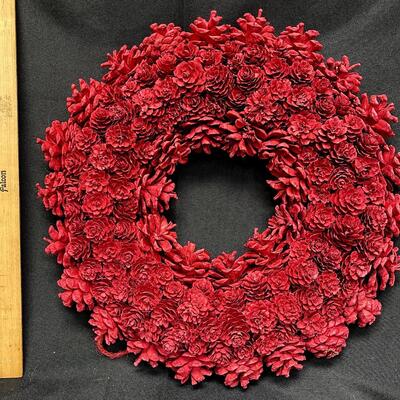 Pinecone wreath painted red for Christmas
