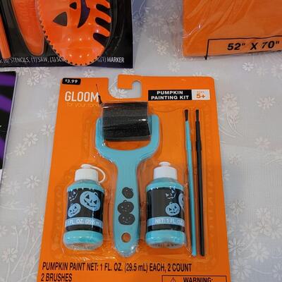 Lot 29: Pumpkin Carving Set. Pumpkin Paints, Pumpkin Tattoos, Stencils and Flannel Backed Disposable Tablecloth 