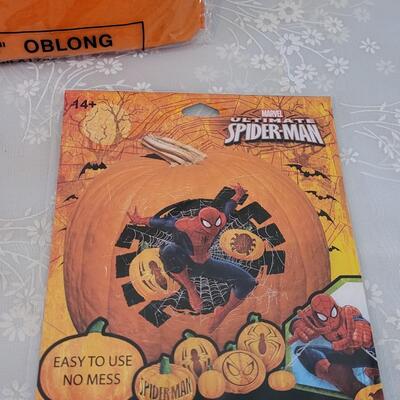 Lot 29: Pumpkin Carving Set. Pumpkin Paints, Pumpkin Tattoos, Stencils and Flannel Backed Disposable Tablecloth 