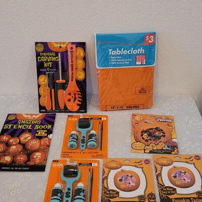 Lot 29: Pumpkin Carving Set. Pumpkin Paints, Pumpkin Tattoos, Stencils and Flannel Backed Disposable Tablecloth 