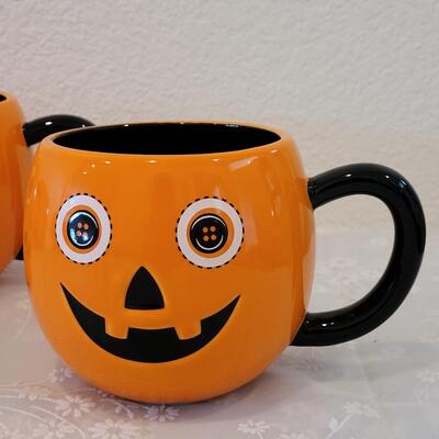 Lot 40: (4) Jack-O-Lantern Coffee Mugs