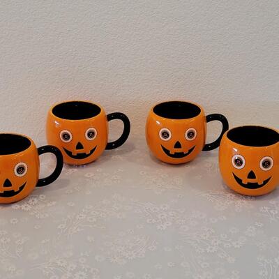 Lot 40: (4) Jack-O-Lantern Coffee Mugs